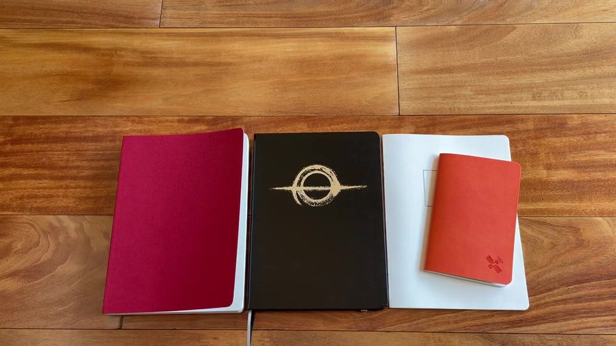 Odyssey Tomoe River notebook lineup on wood floor