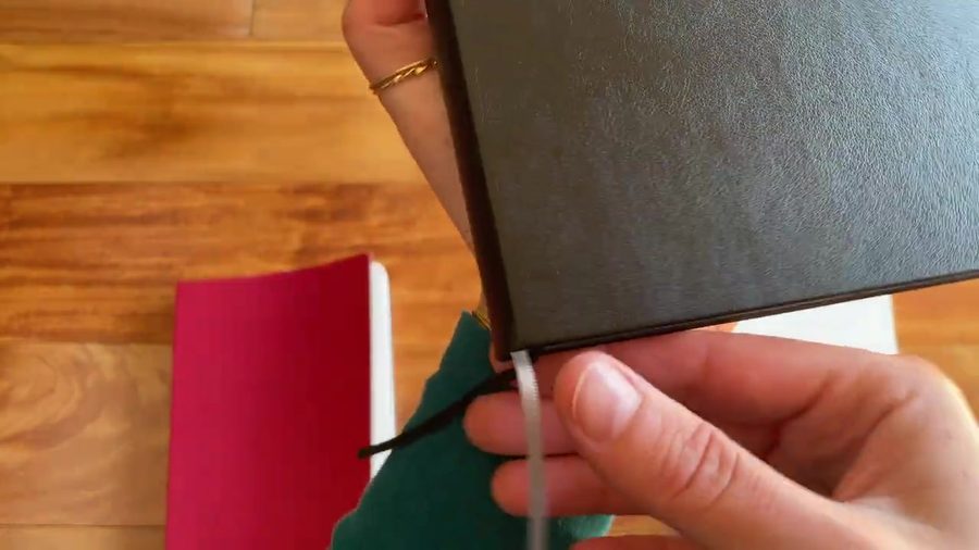 Close look at the black Odyssey notebook cover and binding