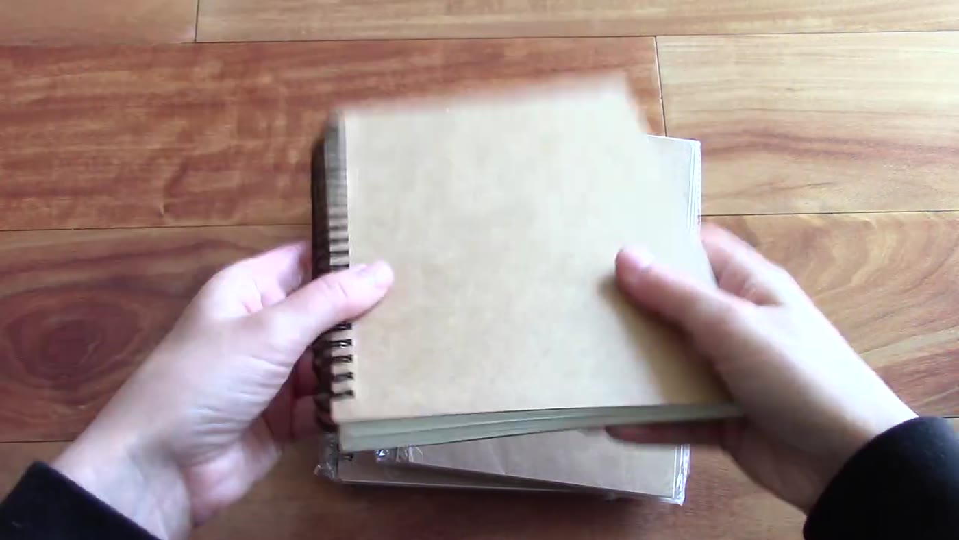 Emerging Green notebook held closed after review