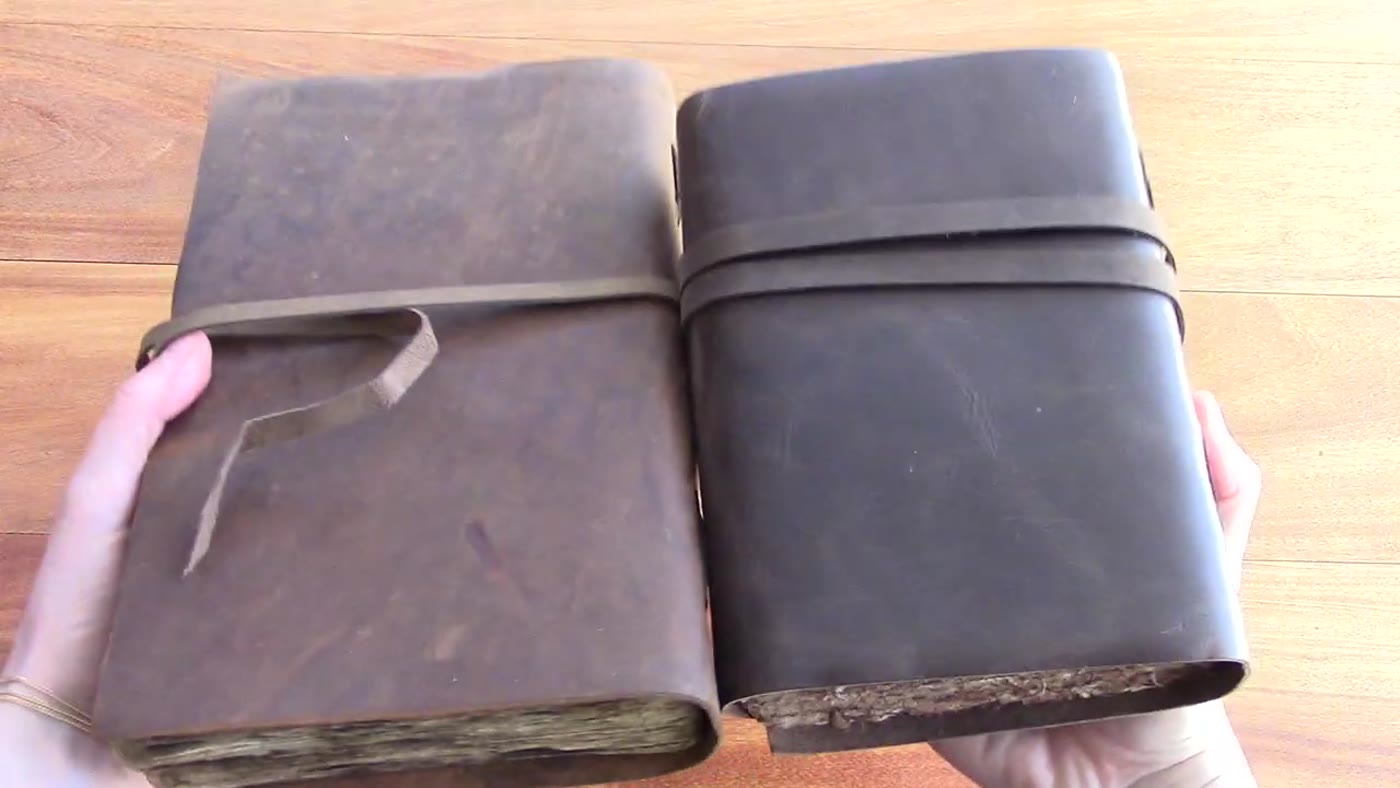 Two Nomad Crafts leather journals shown open and closed