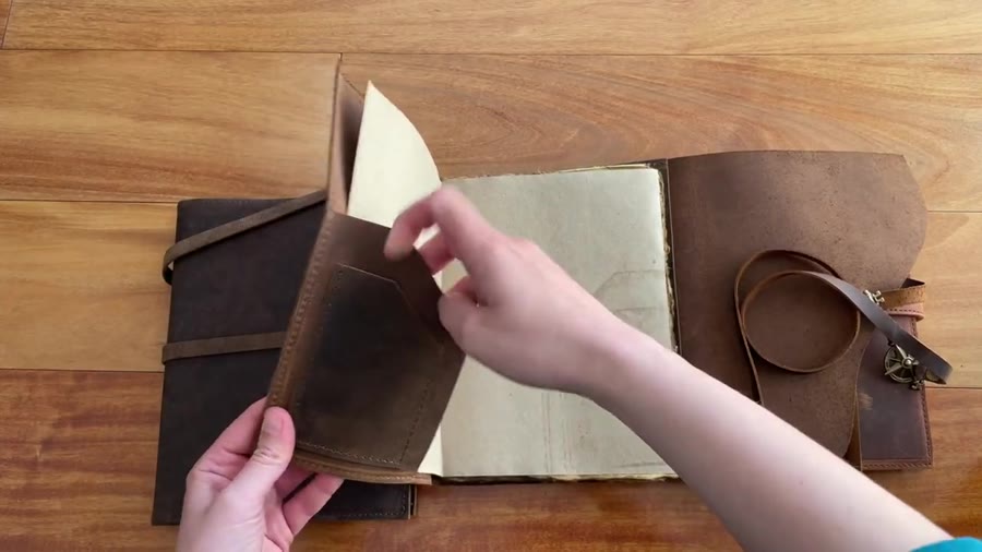 Nomad Crafts refillable insert sliding into the leather cover