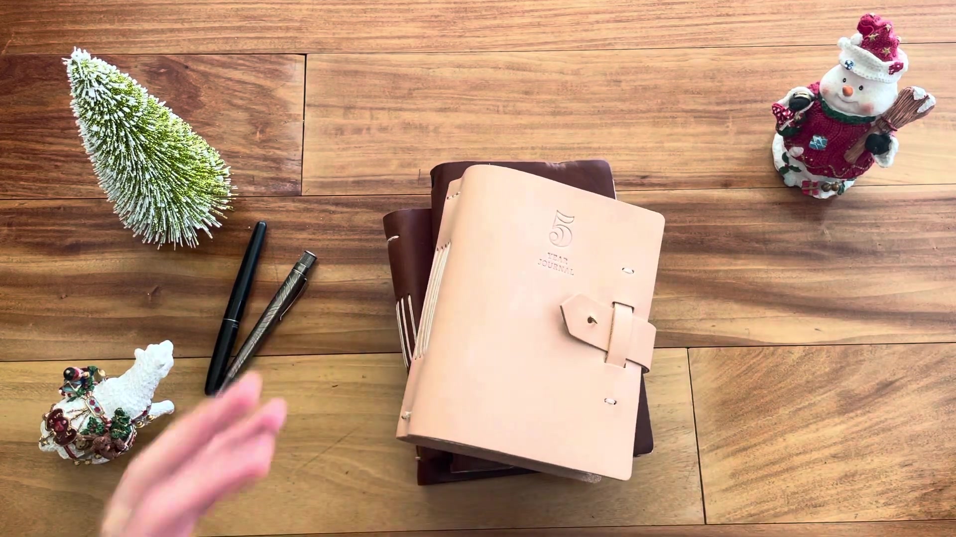 Leather journal gift lineup on a holiday table