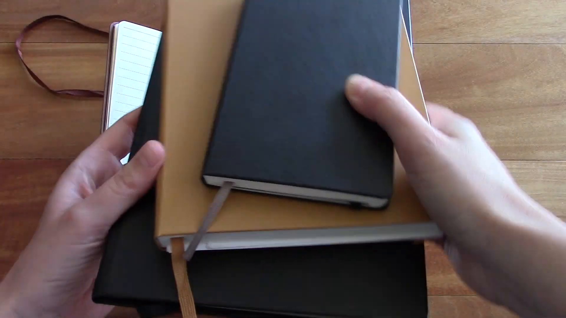 Stack of favorite journals and notebooks compared on the desk