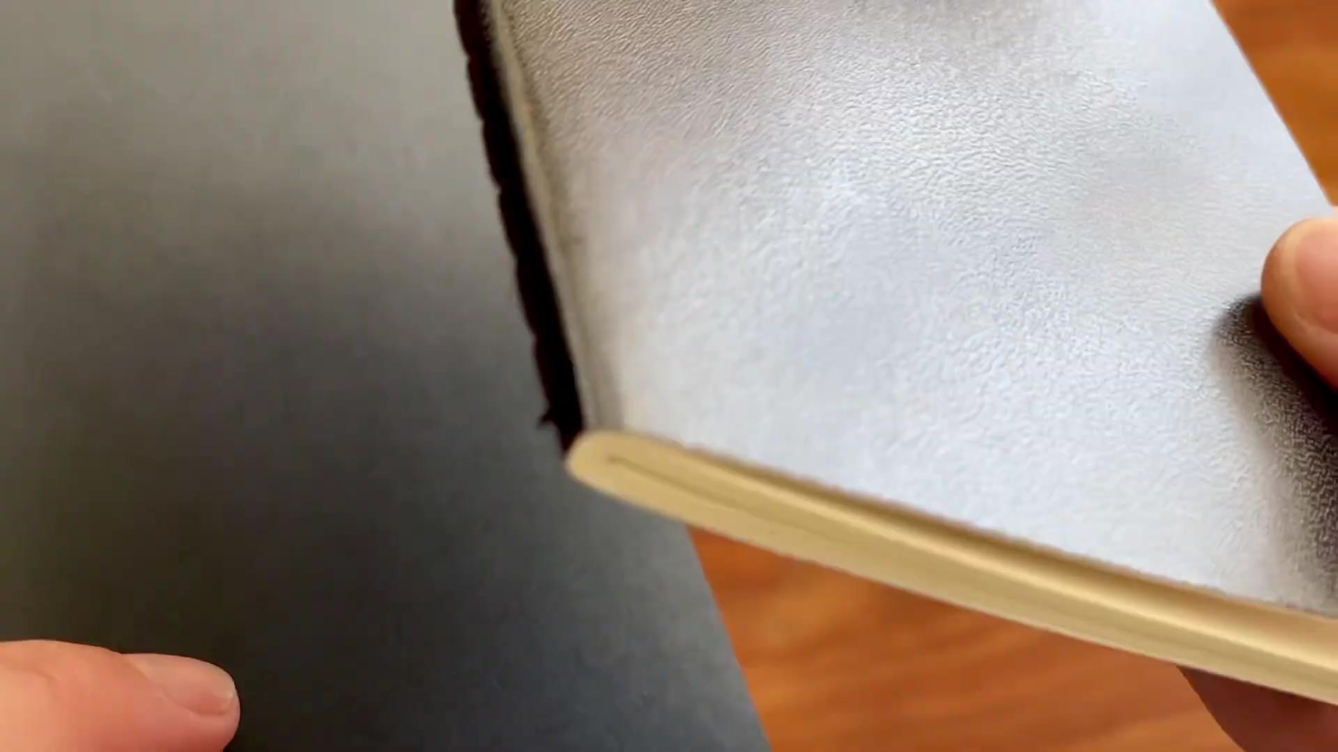 Moleskine vs Daler Rowney Pocket Notebook Comparison 2 Close view comparing Moleskine and Daler Rowney pocket notebook cover materials