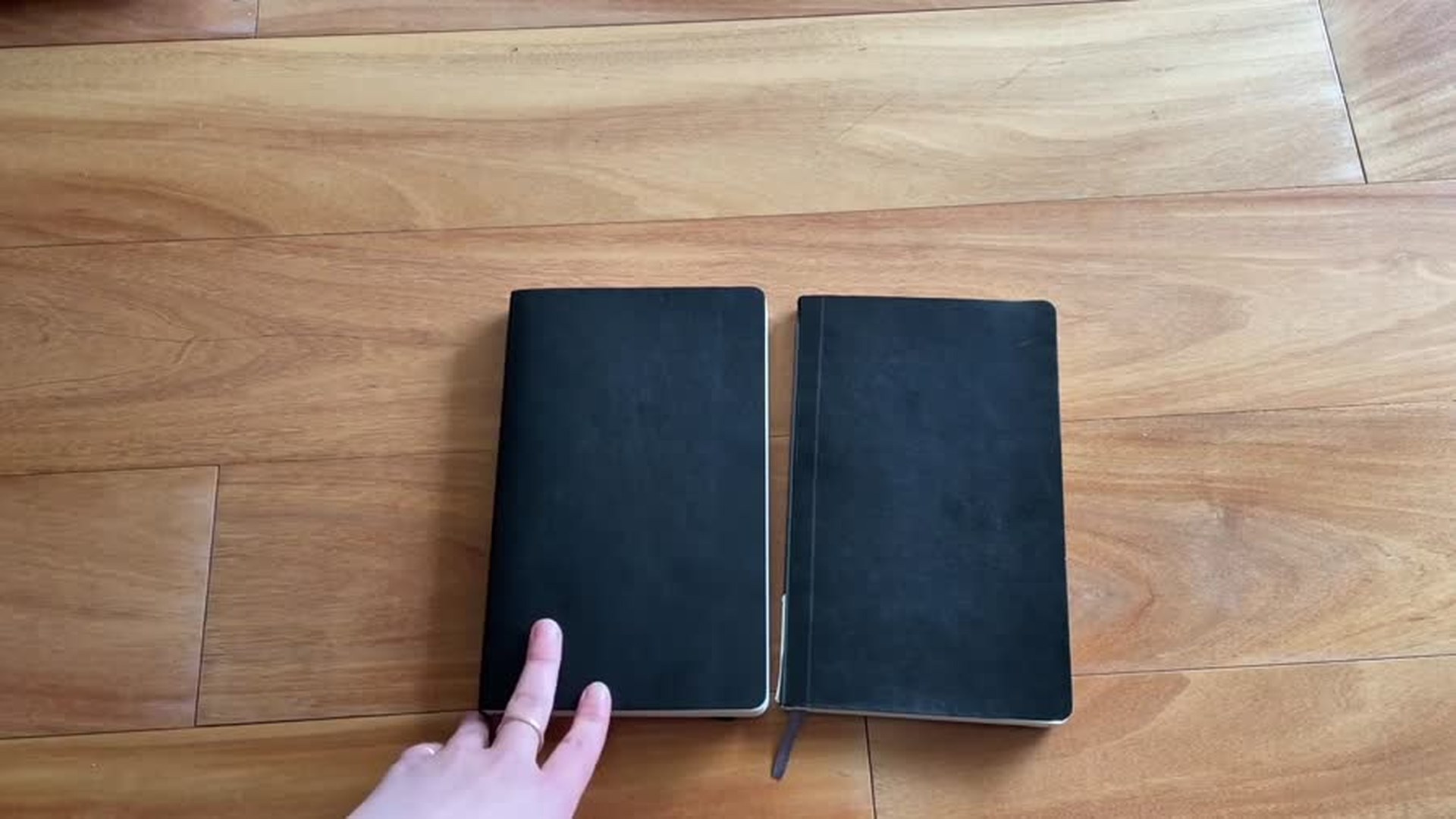 Two Moleskine soft cover notebooks compared for cover texture and finish