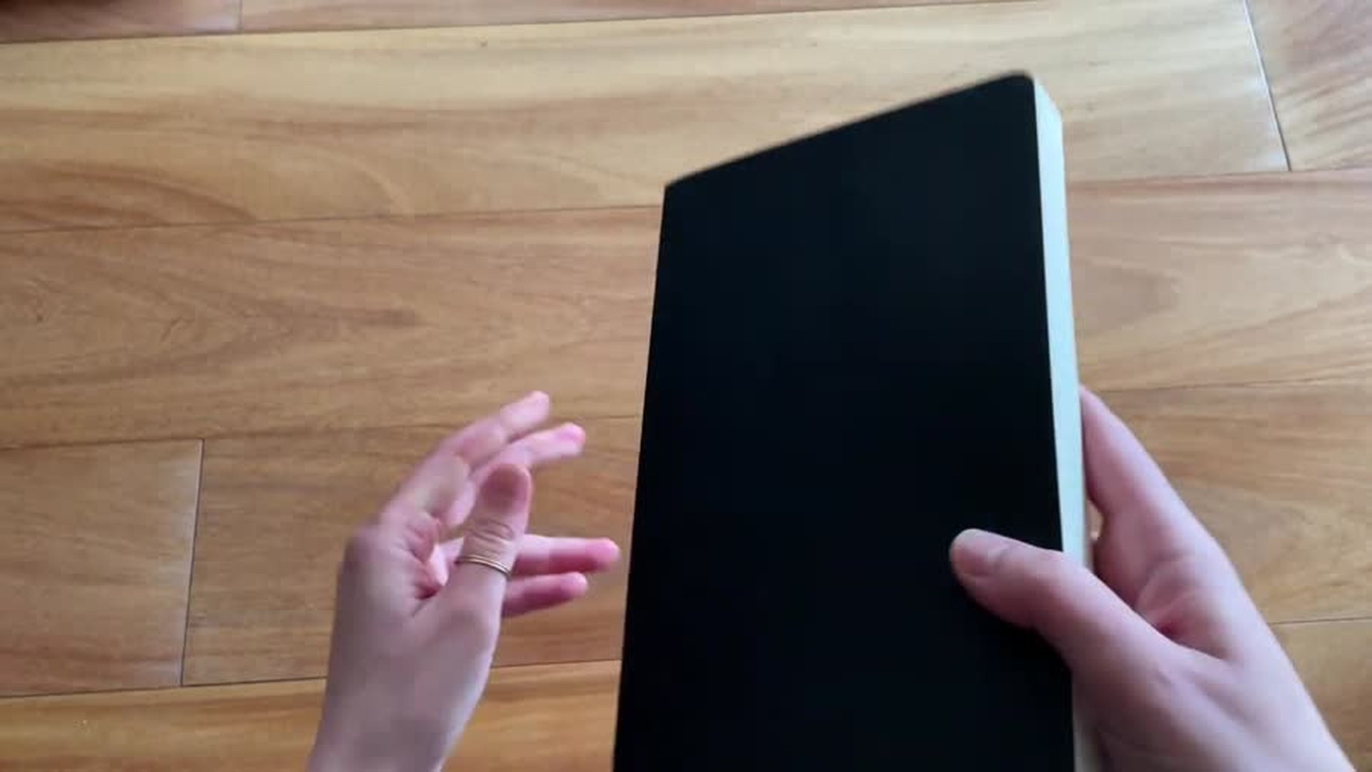 Moleskine soft cover notebook held up to show the new cover material