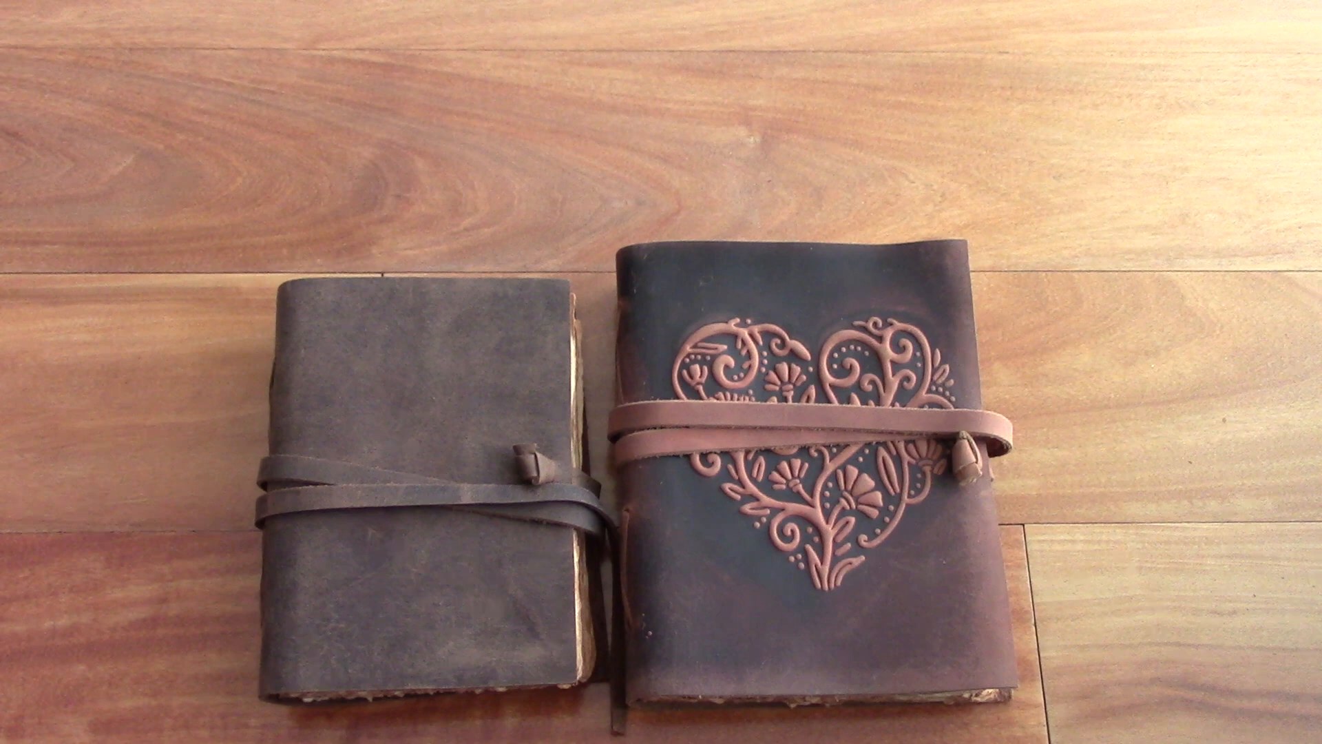 Nomad Crafts Vintage Leather Journal Review 1 Two Nomad Crafts vintage leather journals on a wooden desk