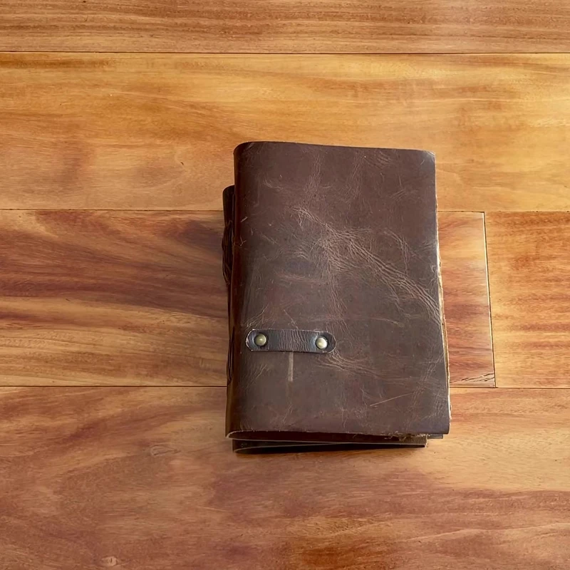 Vintage Feel Notebooks and Journals 1 Vintage leather journal on a wooden desk