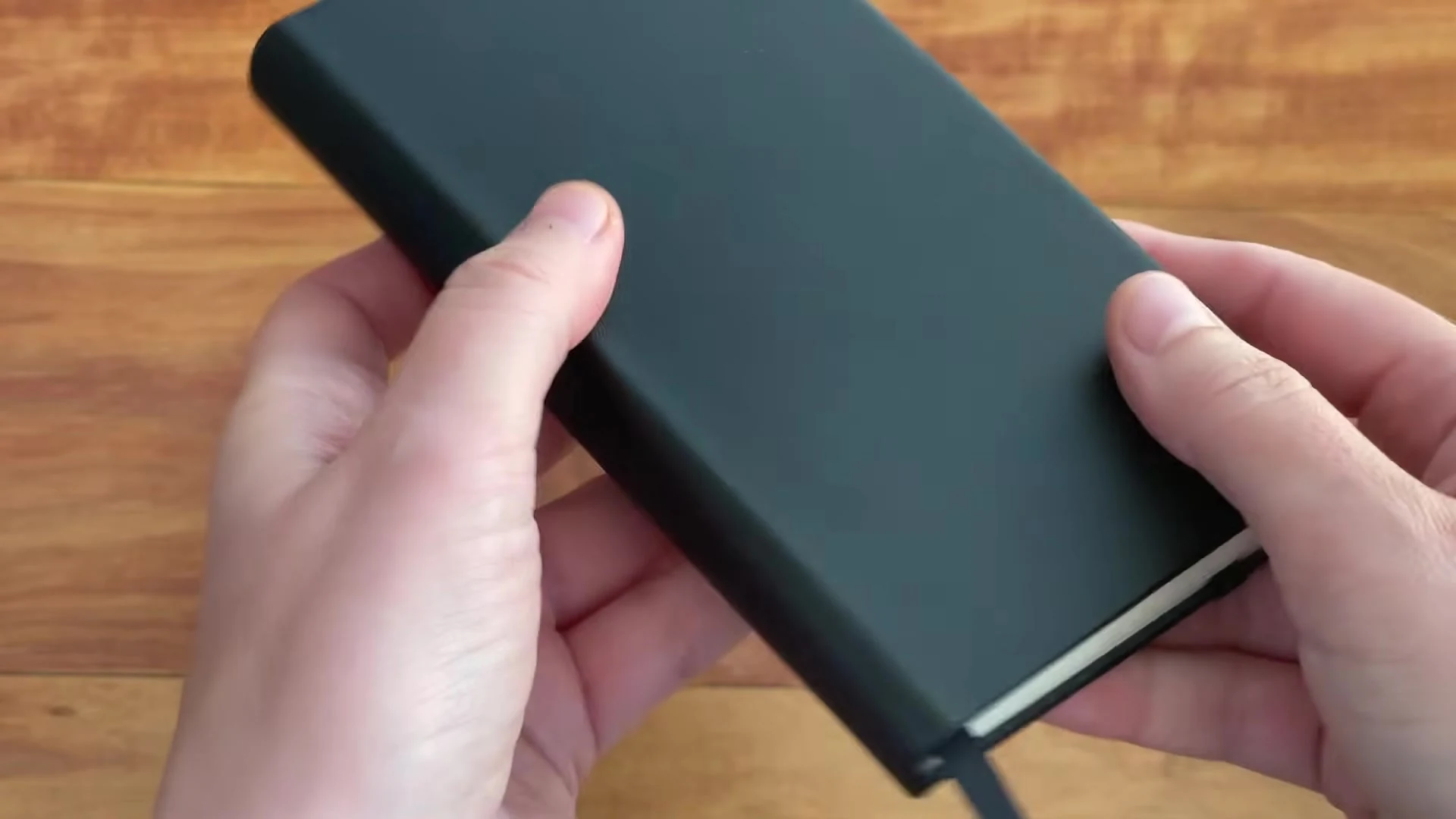 Closed black Writersblok pocket notebook after one month of use
